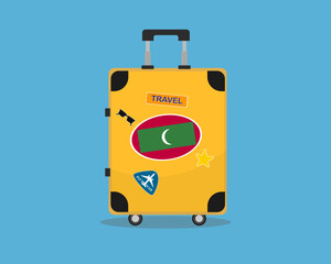 Suitcase or baggage with Maldives flag, holiday and vacation idea