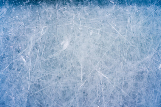 Icy Canvas, Abstract Patterns of Skating and Hockey Marks on Blue Rink Surface Texture.