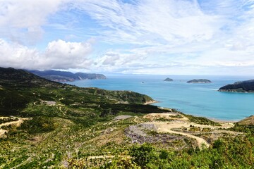 Breathtaking view of the green shoreline and blue sea. Marlborough Sounds, New Zealand.