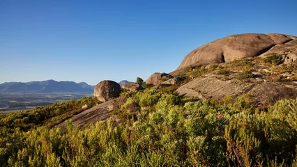 Foto op Canvas Closeup of Paarl Rocks and Paarl at the mountains of Paarl under the blue sky in South Africa © Wirestock