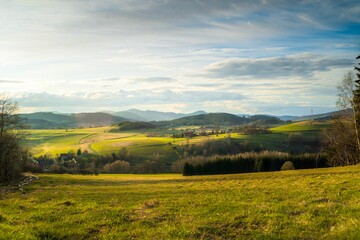 Stunning landscape with a winding road through a lush green valley Lower Silesia during golden hour