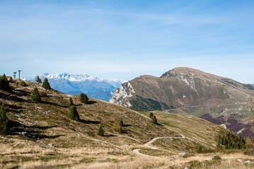 Scenic mountain landscape with snowy peaks in the distance on a sunny day