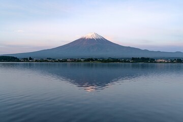 Scenic view of Mount Fuji against a stunning pastel blue and pink sunrise sky backdrop
