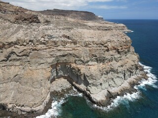 View of Gran Canaria shoreline, showcasing an old eroded cavern.