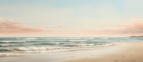 Fototapeta premium A blurred image of a beach with the ocean in the background, featuring the fluid water blending into the sky, clouds hovering over the horizon, and waves creating a beautiful landscape