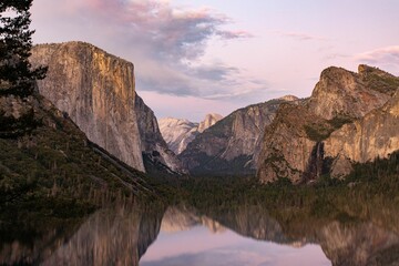 Scenic view of a lake in mountains in Yosemite National Park, California at sunset