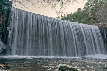 Waterfall of the Lozoya river, Pradillo reservoir in Madrid, Rascafria, Spain