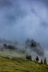 Austrian Serenity: The Tranquil Beauty of Cloud-Wrapped Mountains