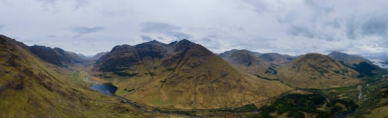 Panoramic scenic vista featuring an array of lush green mountains