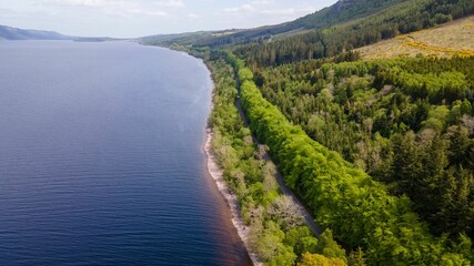 Breathtaking scenic landscape featuring a lush green valley with a river flowing through it