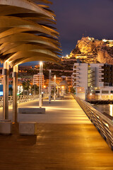 Harbour promenade and Santa Barbara castle. Alicante City, Valencia Community, Spain - stock photo