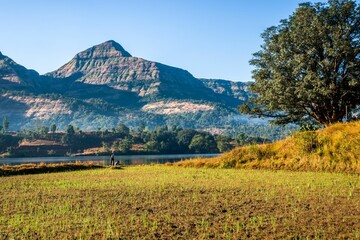 Beautiful green landscape with hills at Arthur Lake in Bhandardara in Maharashtra, India