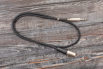 audio xlr trs cable on wood background