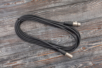 audio xlr cable on wood background - 771525713