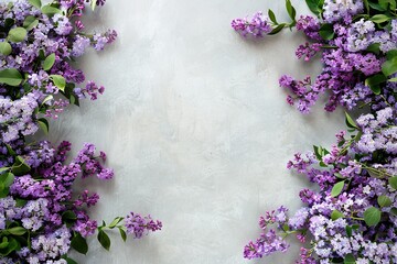 Fototapeta na wymiar Lilac blossoms frame a rustic grey background, ideal for a spring-themed card.