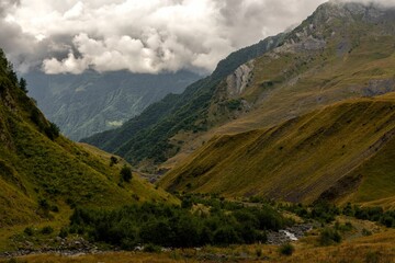 Stunning mountain range with rolling hills and lush green grass carpeting the landscape, Georgia