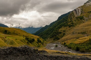 Stunning mountain range with rolling hills and lush green grass carpeting the landscape, Georgia