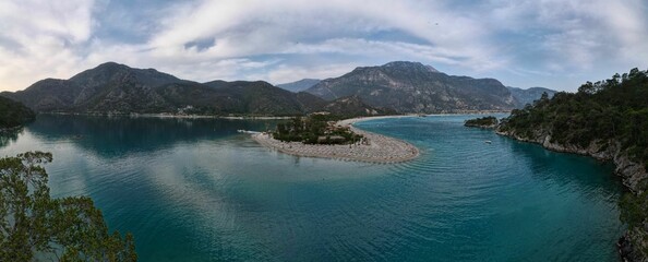 Scenic panoramic view of Blue Lagoon surrounded by majestic mountains. Oludeniz, Fethiye, Turkey.
