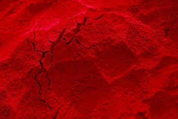 a red, cracked piece of rock with cracked cracks