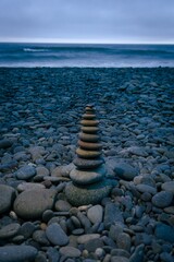 Fototapeta na wymiar some pebbles stacked in balance at the beach