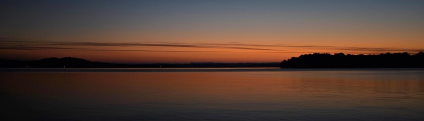 Obraz premium The transition from twilight to night, capturing the last light fading into darkness no dust