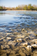 rocks are covered in water as the sun shines on it