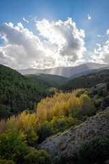 sun rays over the mountains in california's big sur region