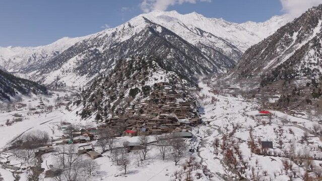 Scenic Kalasha Village in Bamburet Valley in North Pakistan at Winter. Aerial View Hindu Kush Muntain Range Himalayas.