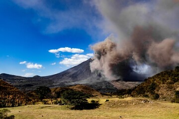 Plume of smoke billows from the active and destructive volcano at Batangan