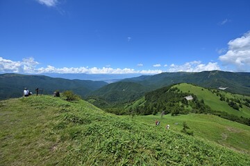 Scenic view of green mountains on a sunny day