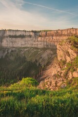 Scenic view of green cliffs at golden hour