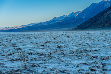Dawn at Badwater Basin in Death Valley, the lowest point in US at 86 meter below sea level. Death Valley National Park, CA is the hottest place on earth with a temperature of 56,7 °C recorded in 1913. - 771537318
