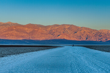 Dawn at Badwater Basin in Death Valley, the lowest point in US at 86 meter below sea level. Death Valley National Park, CA is the hottest place on earth with a temperature of 56,7 °C recorded in 1913. - 771537360