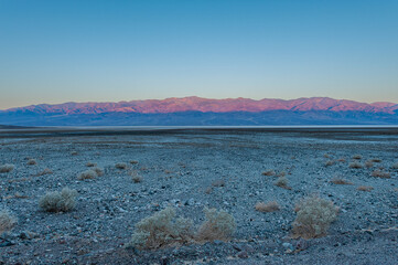 Dawn at Badwater Basin in Death Valley, the lowest point in US at 86 meter below sea level. Death Valley National Park, CA is the hottest place on earth with a temperature of 56,7 °C recorded in 1913. - 771537362