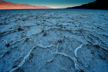 Dawn at Badwater Basin in Death Valley, the lowest point in US at 86 meter below sea level. Death Valley National Park, CA is the hottest place on earth with a temperature of 56,7 °C recorded in 1913. - 771542172