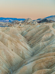 View from Zabriskie Point at dusk. Death Valley National Park in Inyo County of Mojave Desert, California is the hottest place on earth with a temperature of 56,7 °C recorded in 1913. - 771542390
