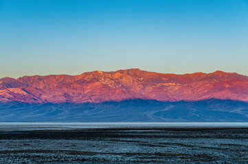 Dawn at Badwater Basin in Death Valley, the lowest point in US at 86 meter below sea level. Death Valley National Park, CA is the hottest place on earth with a temperature of 56,7 °C recorded in 1913. - 771542534