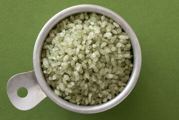 Uncooked Jade Rice in a Vintage Measuring Cup - 771549504