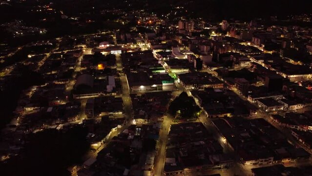 aerial images of the municipality of Calarca at night with the lighting of its streets and the sky