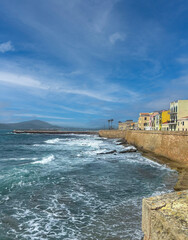 view of the promenade of the historic Catalan ramparts of Alghero.