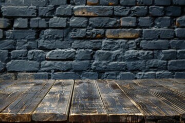 A wooden table with a brick wall in the background
