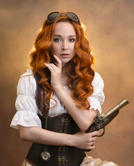 Portrait of a red-haired girl in steampunk style with an antique revolver