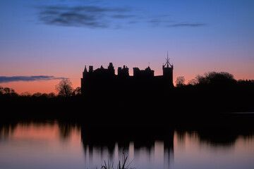 An old Scottish castle on a lake at sunrise. Linlithgow Palace, Scotland