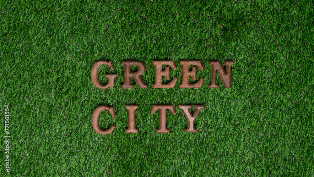 Wall mural environmental awareness campaign showcase message arranged in green city on biophilic green grass ba