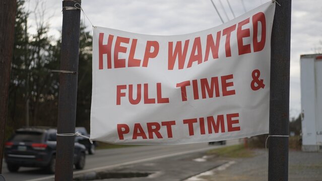 Help Wanted sign hanging by side of a rural West Virginia road in autumn.