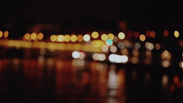 Riverbank expressway defocused lights from traffic at night in Paris