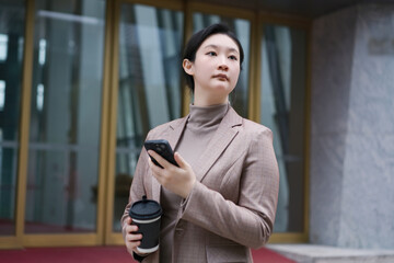 Modern Professional Woman Balancing Work and Coffee