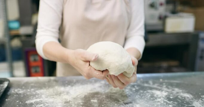 Chef, hands and dough with wheat in bakery with production, process and handmade bread in restaurant or cafe. Person, closeup and cooking in kitchen for service, culinary or pastry with preparation
