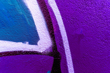 Colorful aerosol street wall background. Urban modern art texture. Wallpaper design backdrop pattern. Painted city wall close up.