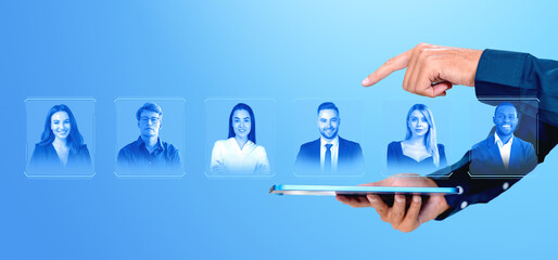 Businessman finger touch tablet and virtual screen with employees